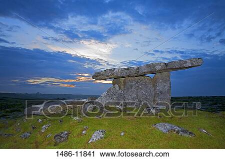 Megalithic stone tomb at dusk, Poulnabrone Dolmen, The Burren, County Clare, Munster Province, Republic of Ireland View Large Photo Image Stock Image - Megalithic stone tomb at dusk, Poulnabrone Dolmen, The Burren, County Clare, Munster Province, Republic of Ireland. Fotosearch