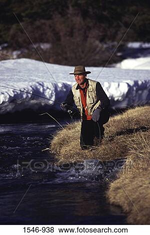 Mid adult man fishing in a creek, Sagehen Creek, California, USA View Large Photo Image Stock Photo - Mid adult man fishing in a creek, Sagehen Creek, California, USA. Fotosearch