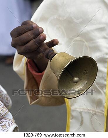 Mid section view of a priest holding a bell in Timkat celebration, Addis Ababa, Shewa, Ethiopia View Large Photo Image Stock Photo - Mid section view of a priest holding a bell in Timkat celebration, Addis Ababa, Shewa, Ethiopia. Fotosearch