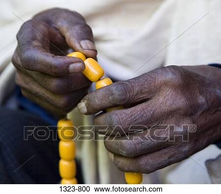 Mid section view of a priest holding worry beads, Ethiopia View Large Photo Image Stock Image - Mid section view of a priest holding worry beads, Ethiopia. Fotosearch
