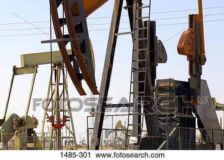 Oil pump at an oil well View Large Photo Image Stock Image - Oil pump at an oil well. Fotosearch
