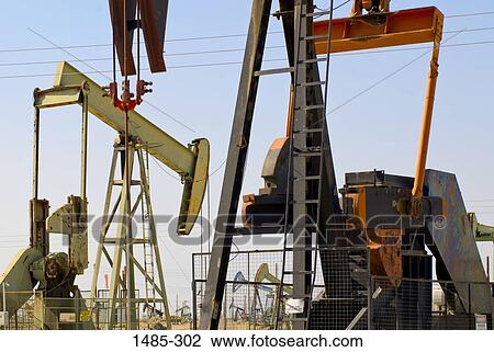 Oil pump at an oil well View Large Photo Image Stock Image - Oil pump at an oil well. Fotosearch