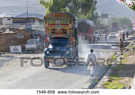 Ornate trucks cars and pedestrians on the main street of a town, Karakoram Highway, Pakistan View Large Photo Image Stock Photo - Ornate trucks cars and pedestrians on the main street of a town, Karakoram Highway, Pakistan. Fotosearch
