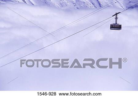 Overhead cable car over a snow covered mountain, Chamonix, Haute-Savoie, Rhone-Alpes, France View Large Photo Image Stock Photo - Overhead cable car over a snow covered mountain, Chamonix, Haute-Savoie, Rhone-Alpes, France. Fotosearch
