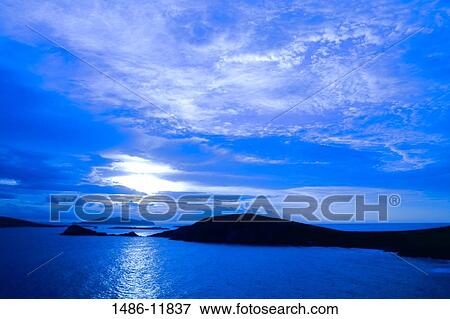 Panoramic view of the sea and islands at sunset, Slea Head, Blasket Islands, Dingle Peninsula, County Kerry, Munster Province, Republic of Ireland View Large Photo Image Stock Photo - Panoramic view of the sea and islands at sunset, Slea Head, Blasket Islands, Dingle Peninsula, County Kerry, Munster Province, Republic of Ireland. Fotosearch
