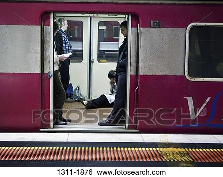 Passengers in a subway train, Melbourne, Victoria, Australia View Large Photo Image Stock Photograph - Passengers in a subway train, Melbourne, Victoria, Australia. Fotosearch