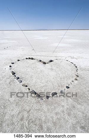 Picture - Pebbles arranged in heart shape on a salt flat, Bonneville Salt Flats, Utah, USA. Fotosearch