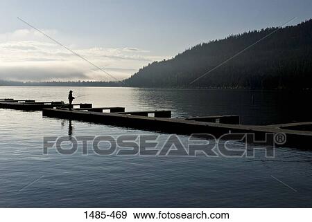 Person fishing in a lake, Donner Lake, Truckee, Nevada County, California, USA View Large Photo Image Stock Photo - Person fishing in a lake, Donner Lake, Truckee, Nevada County, California, USA. Fotosearch