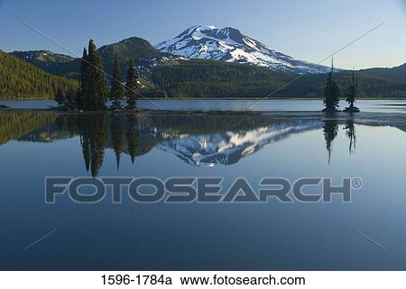 Reflection of a mountain in a lake, Sparks Lake, South Sister, Cascade Lakes Scenic Byway, Deschutes National Forest, Oregon, USA View Large Photo Image Stock Image - Reflection of a mountain in a lake, Sparks Lake, South Sister, Cascade Lakes Scenic Byway, Deschutes National Forest, Oregon, USA. Fotosearch