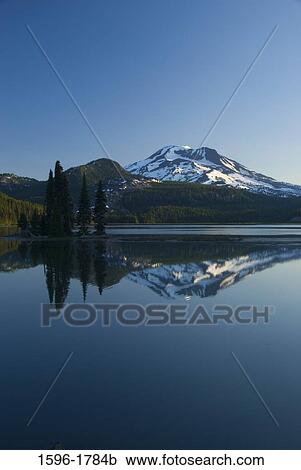 Reflection of a mountain in a lake, Sparks Lake, South Sister, Cascade Lakes Scenic Byway, Deschutes National Forest, Oregon, USA View Large Photo Image Stock Image - Reflection of a mountain in a lake, Sparks Lake, South Sister, Cascade Lakes Scenic Byway, Deschutes National Forest, Oregon, USA. Fotosearch