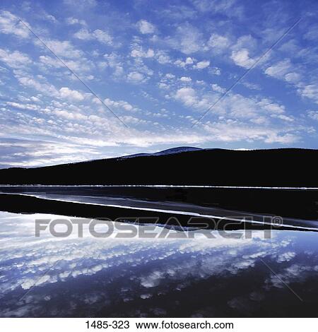 Reflection of clouds and a mountain in water, Colorado, USA View Large Photo Image Stock Image - Reflection of clouds and a mountain in water, Colorado, USA. Fotosearch