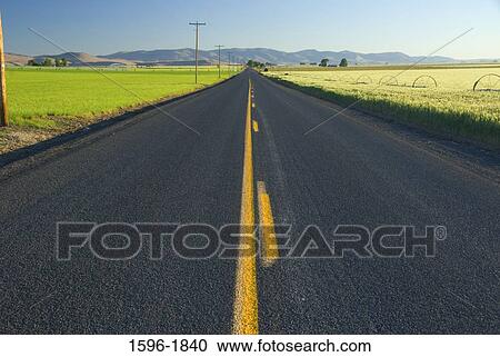 Stock Image - Road passing through a plateau, Agency Plains, Jefferson County, Oregon, USA. Fotosearch