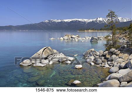 Stock Photography - Rocks in a lake, East Shore, Lake Tahoe, Nevada, USA. Fotosearch