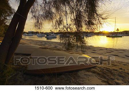 Stock Image - Rowboats on the beach, Queensland, Australia. Fotosearch