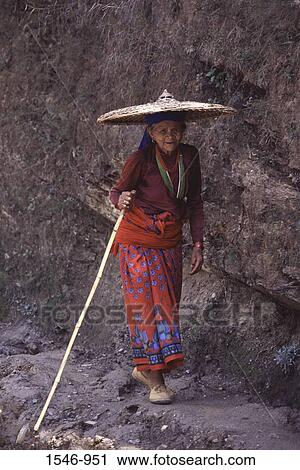 Senior woman walking on a trail, Manaslu Basecamp, Nepal View Large Photo Image Stock Image - Senior woman walking on a trail, Manaslu Basecamp, Nepal. Fotosearch