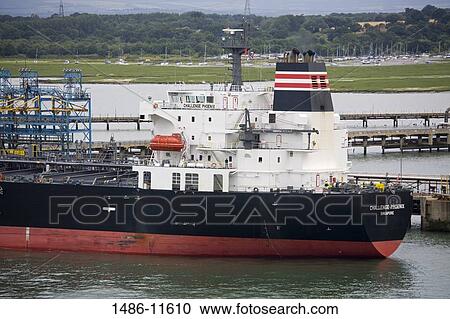 Ship at a harbor, Fawley Oil Refinery, Southampton, Hampshire, England View Large Photo Image Stock Image - Ship at a harbor, Fawley Oil Refinery, Southampton, Hampshire, England. Fotosearch