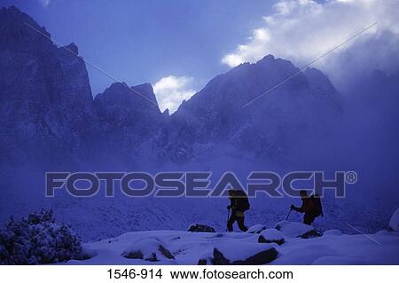 Silhouette of hikers walking in snow, Dusy Basin, Fresno, California, USA View Large Photo Image Picture - Silhouette of hikers walking in snow, Dusy Basin, Fresno, California, USA. Fotosearch
