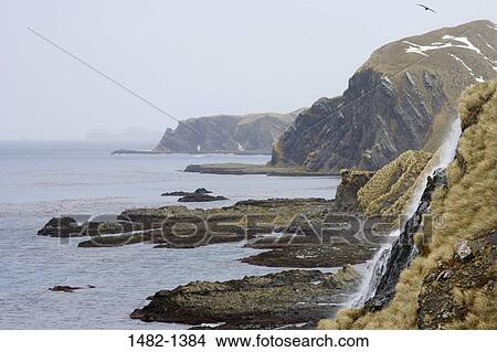 sky, rock, water, cliff, sea, mountain, falling View Large Photo Image Picture - sky, rock, water, cliff, sea, mountain, falling. Fotosearch