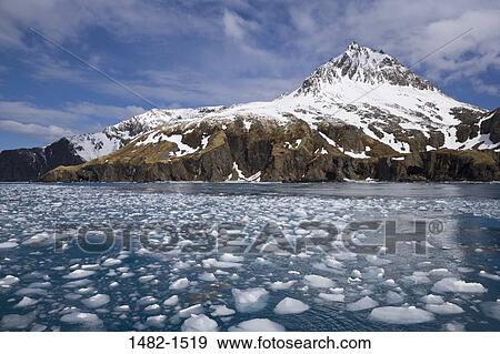 Stock Photo - sky, snow, floating, water, cloud, sea, mountain. Fotosearch