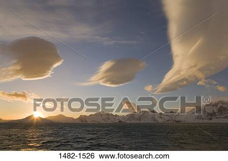 Stock Photograph - sky, snow, water, cloud, morning, sea, mountain. Fotosearch