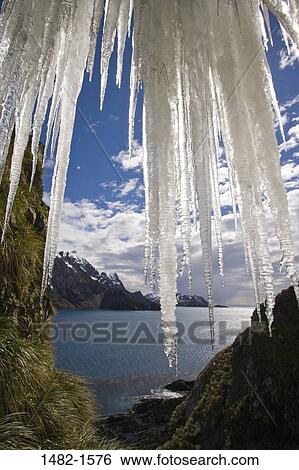 Stock Photograph - sky, water, cloud, hanging, sea, mountain, ice. Fotosearch
