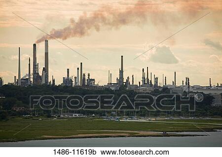 Smoke stacks at a refinery, Fawley Oil Refinery, Southampton, Hampshire, England View Large Photo Image Stock Image - Smoke stacks at a refinery, Fawley Oil Refinery, Southampton, Hampshire, England. Fotosearch