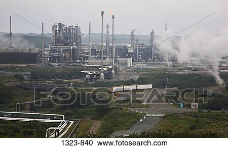 Stock Image - Smoke stacks in an oil refinery, St. John, New Brunswick, Canada. Fotosearch