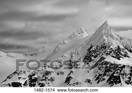 snow, cloud, mountain, overcast, day, covering, cold View Large Photo Image Picture - snow, cloud, mountain, overcast, day, covering, cold. Fotosearch