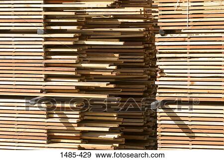 Stock Photo - Stack of planks in a lumberyard, California, USA. Fotosearch