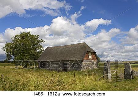 Stock Image - Stone farmhouse in a field, Avebury, Wiltshire, England. Fotosearch