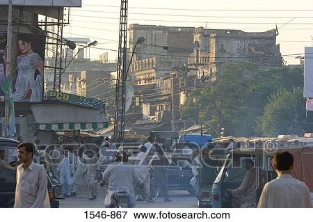 Street scene with pedestrians old buildings pollution and vehicles, Rawalpindi, Pakistan View Large Photo Image Stock Photo - Street scene with pedestrians old buildings pollution and vehicles, Rawalpindi, Pakistan. Fotosearch