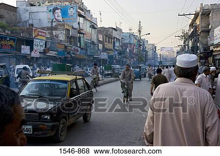 Street scene with pedestrians old buildings pollution and vehicles, Rawalpindi, Pakistan View Large Photo Image Stock Photo - Street scene with pedestrians old buildings pollution and vehicles, Rawalpindi, Pakistan. Fotosearch