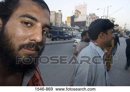 Street scene with pedestrians old buildings pollution and vehicles, Rawalpindi, Pakistan View Large Photo Image Stock Photo - Street scene with pedestrians old buildings pollution and vehicles, Rawalpindi, Pakistan. Fotosearch
