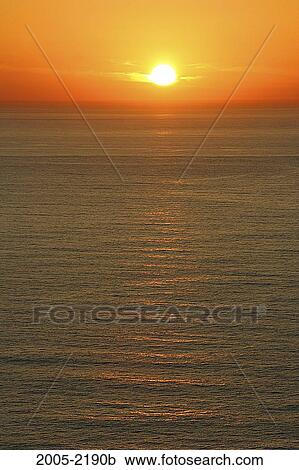 Sunset over the ocean, Big Sur, California, USA View Large Photo Image Stock Image - Sunset over the ocean, Big Sur, California, USA. Fotosearch