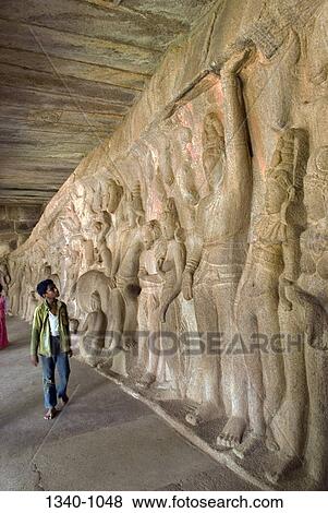 Teenage boy looking at carvings at a temple, Krishna Mandapa, Mahabalipuram, Tamil Nadu, India View Large Photo Image Stock Photo - Teenage boy looking at carvings at a temple, Krishna Mandapa, Mahabalipuram, Tamil Nadu, India. Fotosearch