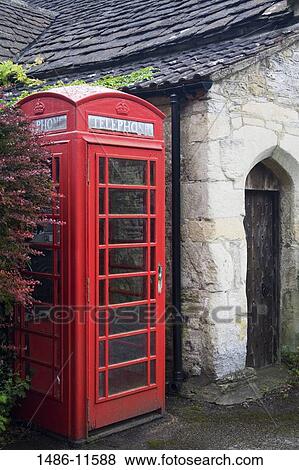 Telephone booth near at the house, Castle Combe, Cotswold, Wiltshire, England View Large Photo Image Stock Photo - Telephone booth near at the house, Castle Combe, Cotswold, Wiltshire, England. Fotosearch
