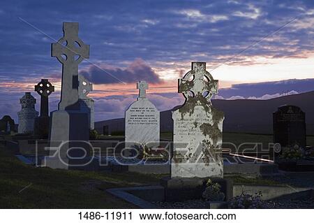 Tombstones in a cemetery, Dunlewy Church, Dunlewy, County Donegal, Ulster Province, Ireland View Large Photo Image Stock Image - Tombstones in a cemetery, Dunlewy Church, Dunlewy, County Donegal, Ulster Province, Ireland. Fotosearch