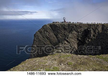 Tourists and a sculpture on a cliff, Honningsvag Port, Honningsvag, Mageroya Island, Nordkapp, Finnmark County, Norway View Large Photo Image Stock Image - Tourists and a sculpture on a cliff, Honningsvag Port, Honningsvag, Mageroya Island, Nordkapp, Finnmark County, Norway. Fotosearch