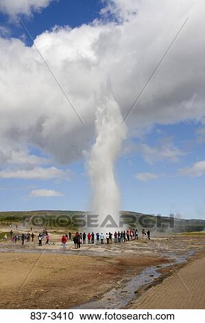 Tourists watching water explosion at a thermal geyser, The Great Geysir, Haukadalur Valley, Iceland View Large Photo Image Stock Image - Tourists watching water explosion at a thermal geyser, The Great Geysir, Haukadalur Valley, Iceland. Fotosearch