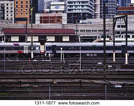 Train on railroad tracks, Southern Cross Station, Melbourne, Victoria, Australia View Large Photo Image Stock Photo - Train on railroad tracks, Southern Cross Station, Melbourne, Victoria, Australia. Fotosearch