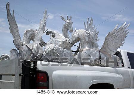 Truck loaded with statues of animals View Large Photo Image Stock Image - Truck loaded with statues of animals. Fotosearch