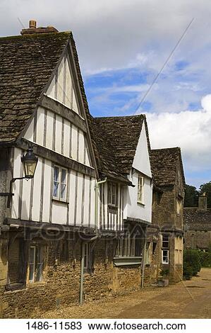 Tudor style houses in a row, Church Street, Lacock, Wiltshire, England View Large Photo Image Stock Image - Tudor style houses in a row, Church Street, Lacock, Wiltshire, England. Fotosearch