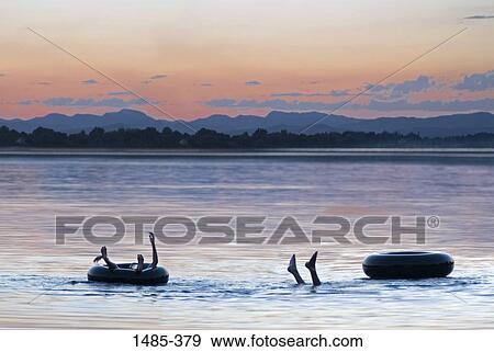 Two people drowning in a lake View Large Photo Image Stock Photo - Two people drowning in a lake. Fotosearch