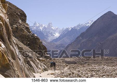 Two people hiking, Baltoro Glacier, Karakoram Range, Baltistan, Pakistan View Large Photo Image Stock Image - Two people hiking, Baltoro Glacier, Karakoram Range, Baltistan, Pakistan. Fotosearch