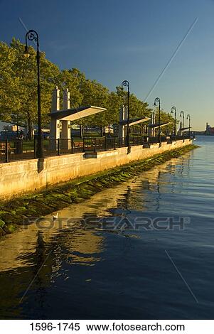 Walkway along a river, Piers Park, Boston, Massachusetts, USA View Large Photo Image Stock Photography - Walkway along a river, Piers Park, Boston, Massachusetts, USA. Fotosearch