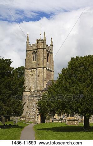Stock Photo - Walkway leading towards a church, St. James Church, Avebury, Wiltshire, England. Fotosearch