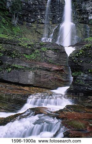 Water flowing through rocks, Virginia Falls, Us Glacier National Park, Montana, USA View Large Photo Image Stock Image - Water flowing through rocks, Virginia Falls, Us Glacier National Park, Montana, USA. Fotosearch