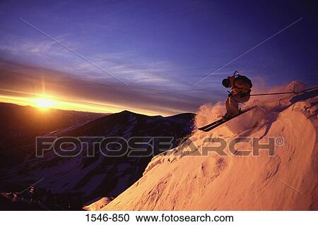 Woman skiing on a snow covered mountain, Sweetwater Mountains, Nevada, USA View Large Photo Image Stock Image - Woman skiing on a snow covered mountain, Sweetwater Mountains, Nevada, USA. Fotosearch