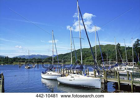 Stock Image - Yachts in a lake, Lake Windermere, Ambleside, English Lake District, Cumbria, England. Fotosearch