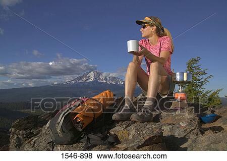 Young woman sitting on a mountain summit, Sleeping Beauty Summit, Mt Adams, Washington State, USA View Large Photo Image Stock Photo - Young woman sitting on a mountain summit, Sleeping Beauty Summit, Mt Adams, Washington State, USA. Fotosearch